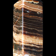 Chocolate Calcite obelisk 98*32*30mm 253g in sunlight - Rocks and Things Store