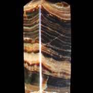 Chocolate Calcite obelisk 98*32*30mm 253g in sunlight - Rocks and Things Store