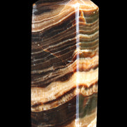 Chocolate Calcite obelisk 98*32*30mm 253g in sunlight - Rocks and Things Store
