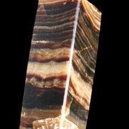 Chocolate Calcite obelisk 98*32*30mm 253g in sunlight - Rocks and Things Store