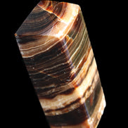 Chocolate Calcite obelisk 98*32*30mm 253g in sunlight - Rocks and Things Store
