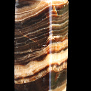 Chocolate Calcite obelisk 98*32*30mm 253g in sunlight - Rocks and Things Store