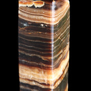 Chocolate Calcite obelisk 98*32*30mm 253g in sunlight - Rocks and Things Store