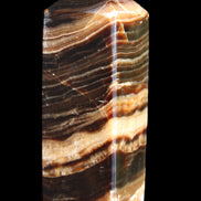 Chocolate Calcite obelisk 98*32*30mm 253g in sunlight - Rocks and Things Store