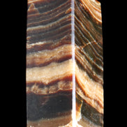 Chocolate Calcite obelisk 98*32*30mm 253g in sunlight - Rocks and Things Store