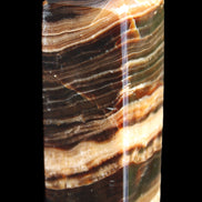 Chocolate Calcite obelisk 98*32*30mm 253g in sunlight - Rocks and Things Store