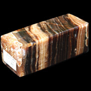 Chocolate Calcite obelisk 98*32*30mm 253g in sunlight - Rocks and Things Store