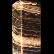 Chocolate Calcite obelisk 98*32*30mm 253g in sunlight - Rocks and Things Store