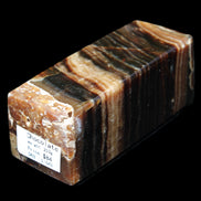 Chocolate Calcite obelisk 98*32*30mm 253g in sunlight - Rocks and Things Store