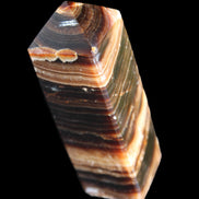 Chocolate Calcite obelisk 98*32*30mm 253g in sunlight - Rocks and Things Store