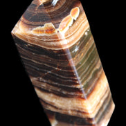Chocolate Calcite obelisk 98*32*30mm 253g in sunlight - Rocks and Things Store