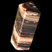 Chocolate Calcite obelisk 98*32*30mm 253g in sunlight - Rocks and Things Store
