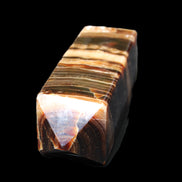 Chocolate Calcite obelisk 98*32*30mm 253g in sunlight - Rocks and Things Store