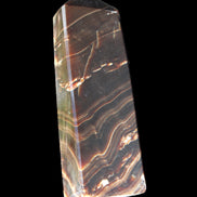 Chocolate Calcite obelisk 107*33*23mm 197.5g in sunlight - Rocks and Things Store