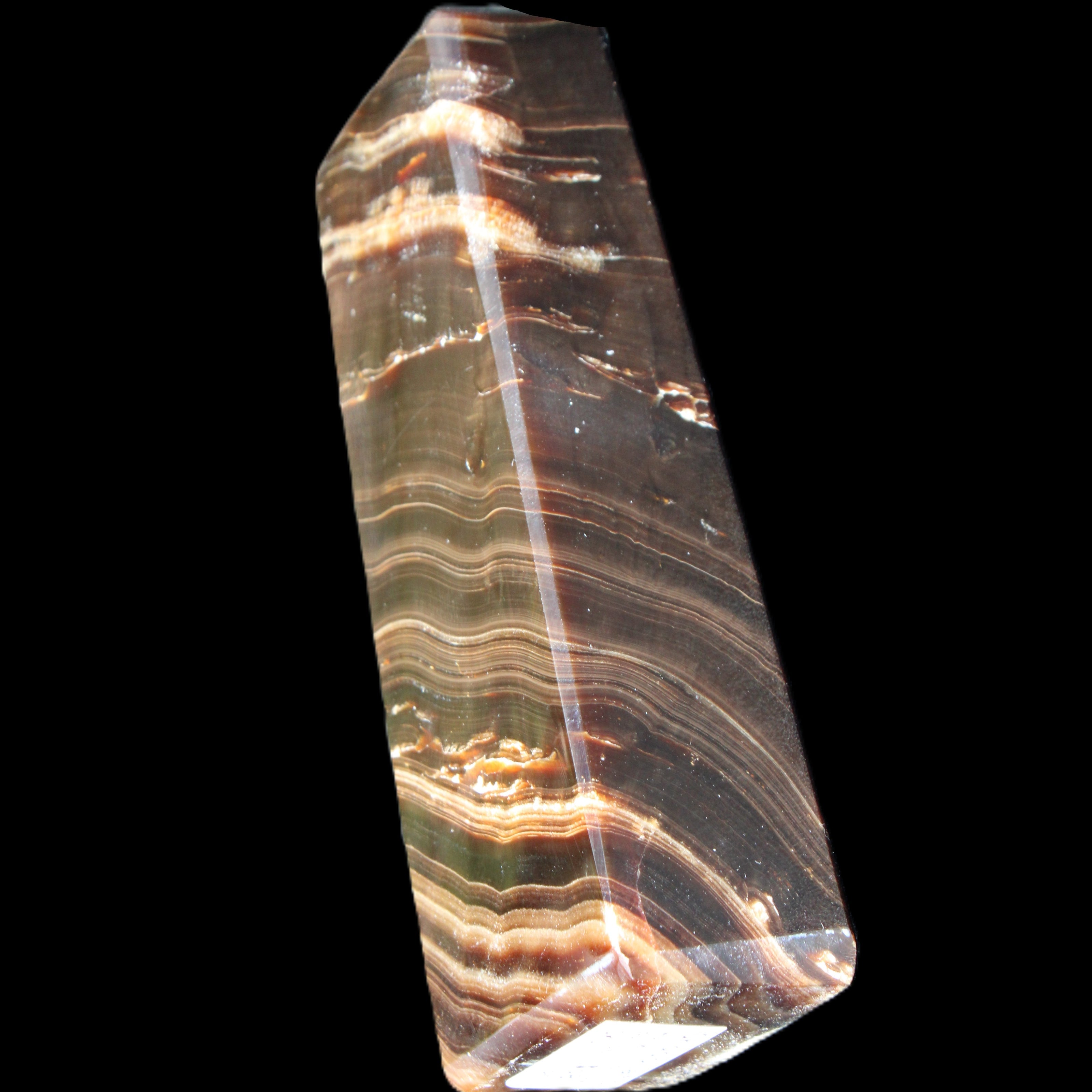 Chocolate Calcite obelisk 107*33*23mm 197.5g in sunlight - Rocks and Things Store