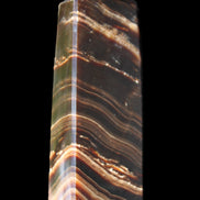 Chocolate Calcite obelisk 107*33*23mm 197.5g in sunlight - Rocks and Things Store