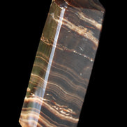 Chocolate Calcite obelisk 107*33*23mm 197.5g in sunlight - Rocks and Things Store