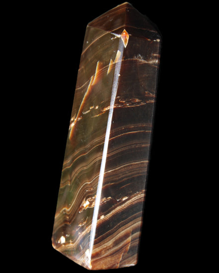 Chocolate Calcite obelisk 107*33*23mm 197.5g in sunlight - Rocks and Things Store