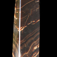 Chocolate Calcite obelisk 107*33*23mm 197.5g in sunlight - Rocks and Things Store
