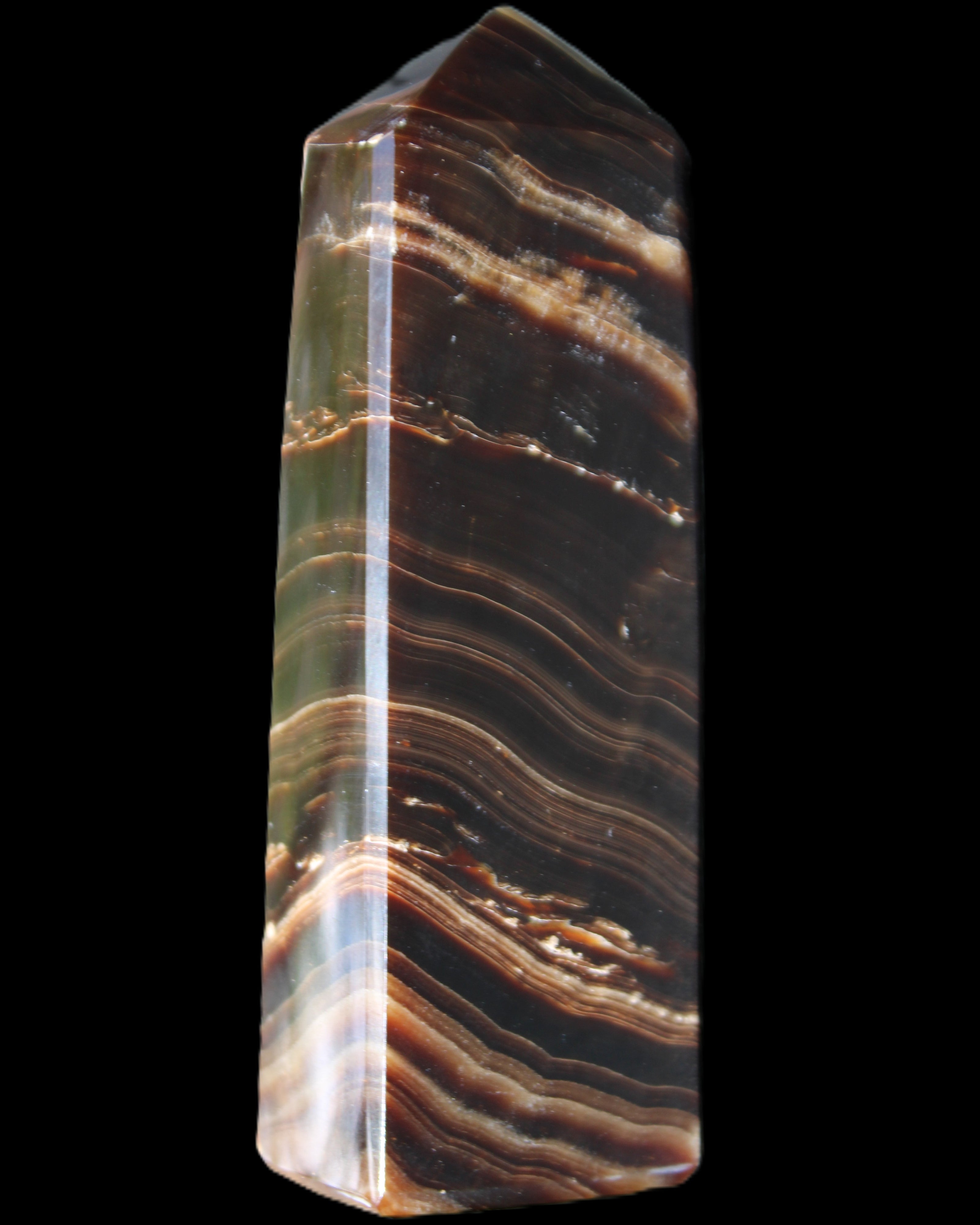 Chocolate Calcite obelisk 107*33*23mm 197.5g in sunlight - Rocks and Things Store