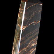 Chocolate Calcite obelisk 107*33*23mm 197.5g in sunlight - Rocks and Things Store