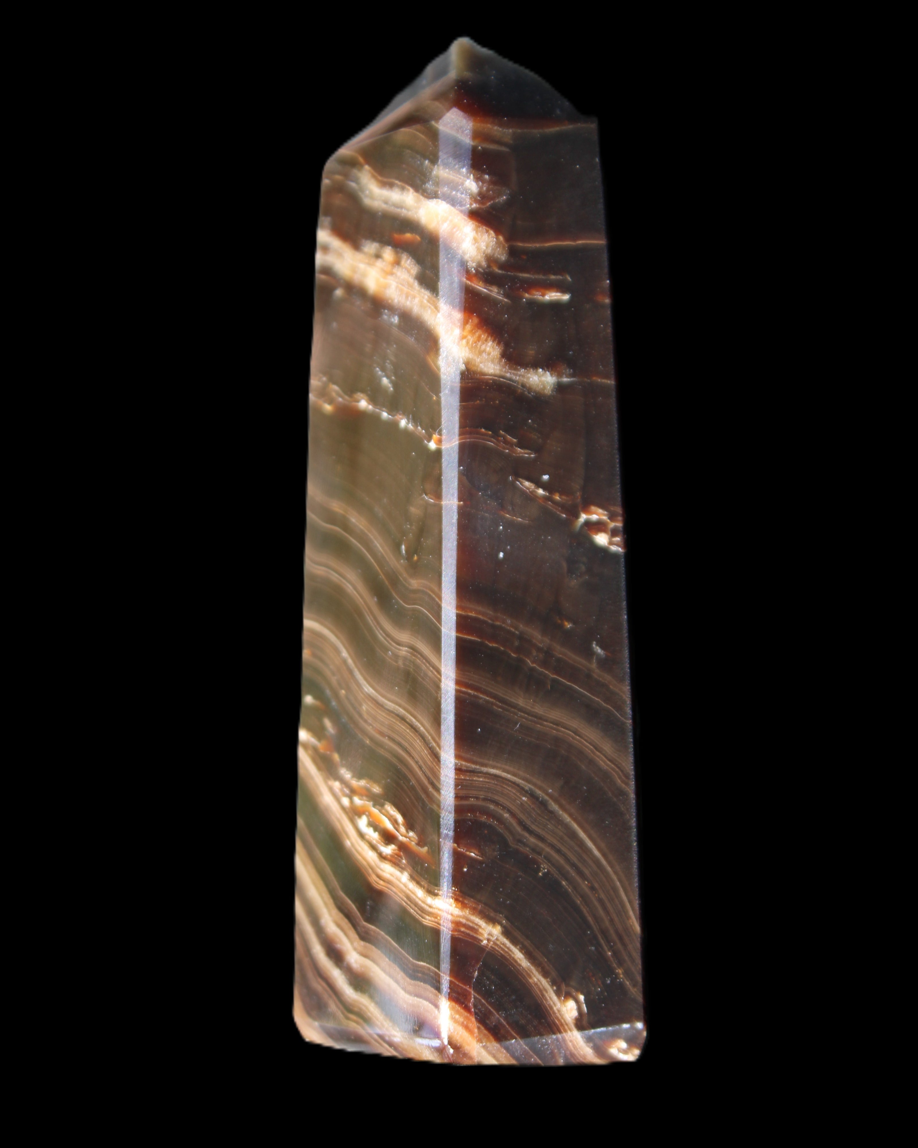 Chocolate Calcite obelisk 107*33*23mm 197.5g in sunlight - Rocks and Things Store