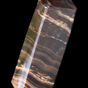 Chocolate Calcite obelisk 107*33*23mm 197.5g in sunlight - Rocks and Things Store