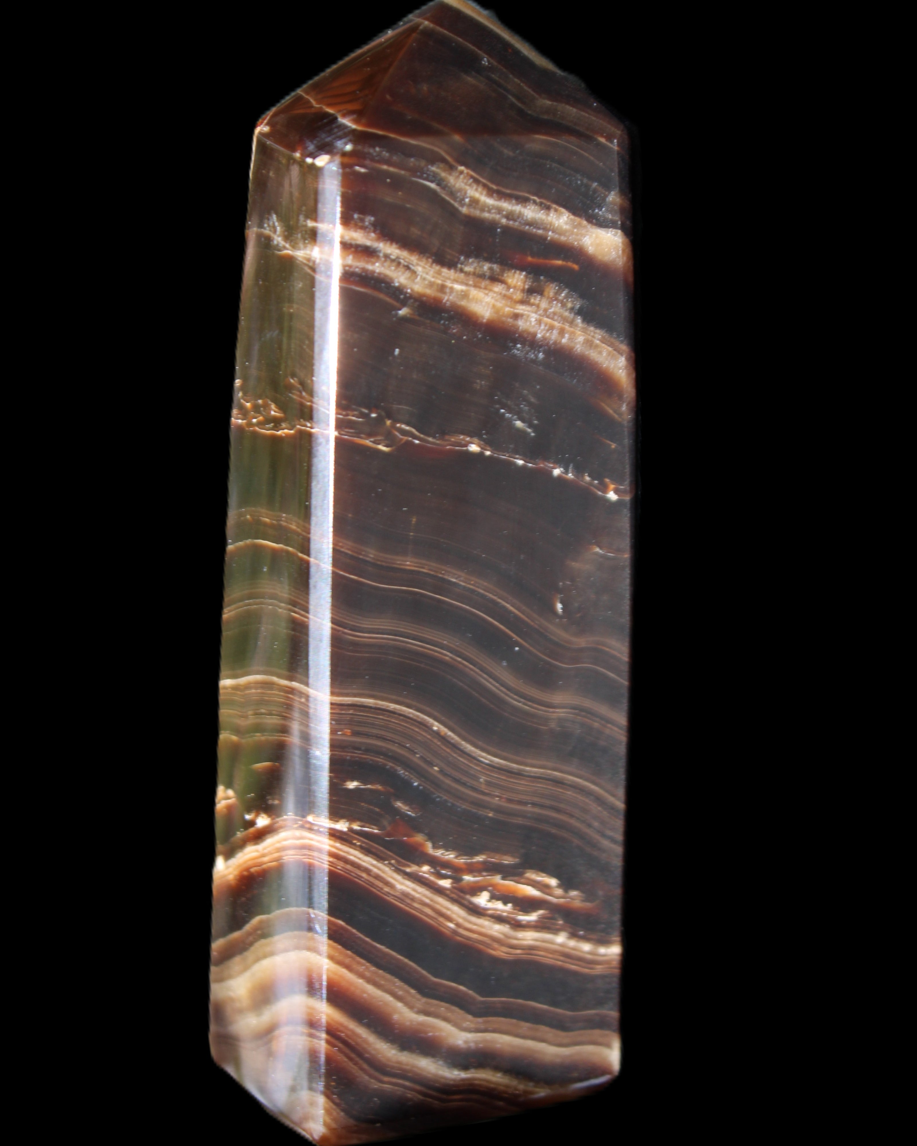 Chocolate Calcite obelisk 107*33*23mm 197.5g in sunlight - Rocks and Things Store