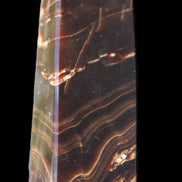 Chocolate Calcite obelisk 107*33*23mm 197.5g in sunlight - Rocks and Things Store