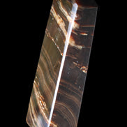 Chocolate Calcite obelisk 107*33*23mm 197.5g in sunlight - Rocks and Things Store