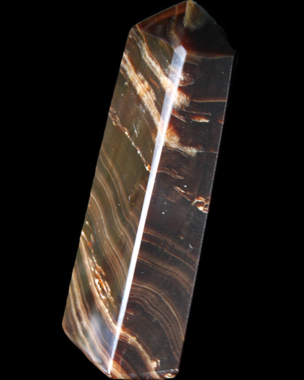 Chocolate Calcite obelisk 107*33*23mm 197.5g in sunlight - Rocks and Things Store