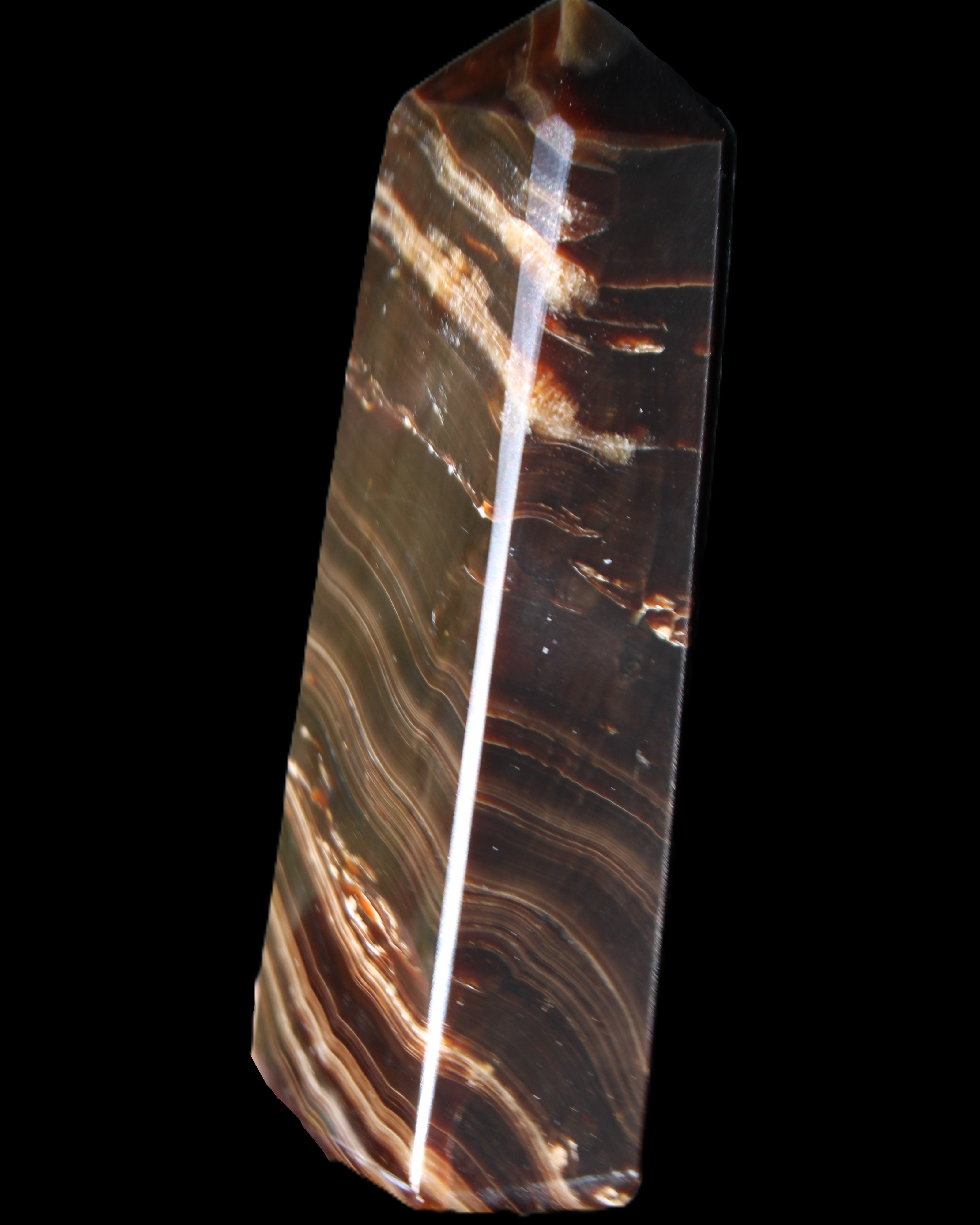 Chocolate Calcite obelisk 107*33*23mm 197.5g in sunlight - Rocks and Things Store