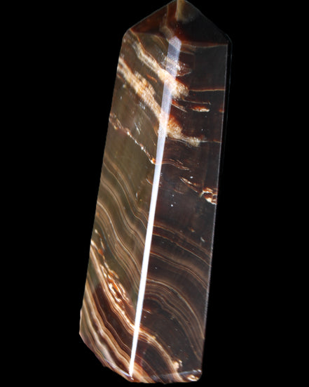 Chocolate Calcite obelisk 107*33*23mm 197.5g in sunlight - Rocks and Things Store