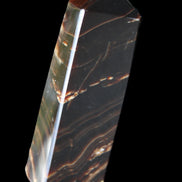 Chocolate Calcite obelisk 107*33*23mm 197.5g in sunlight - Rocks and Things Store