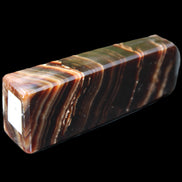 Chocolate Calcite obelisk 107*33*23mm 197.5g in sunlight - Rocks and Things Store