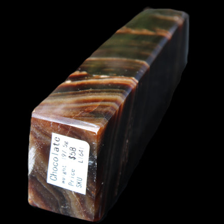 Chocolate Calcite obelisk 107*33*23mm 197.5g in sunlight - Rocks and Things Store