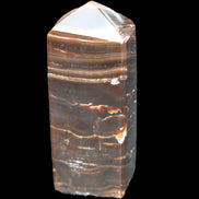 Chocolate Calcite obelisk 92*33*28mm 196g in sunlight - Rocks and Things Store