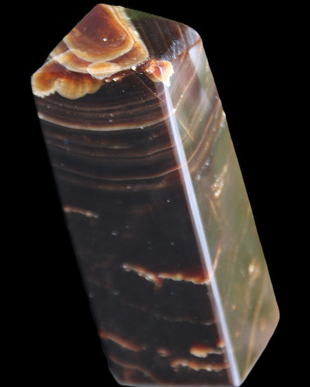 Chocolate Calcite obelisk 92*33*28mm 196g in sunlight - Rocks and Things Store