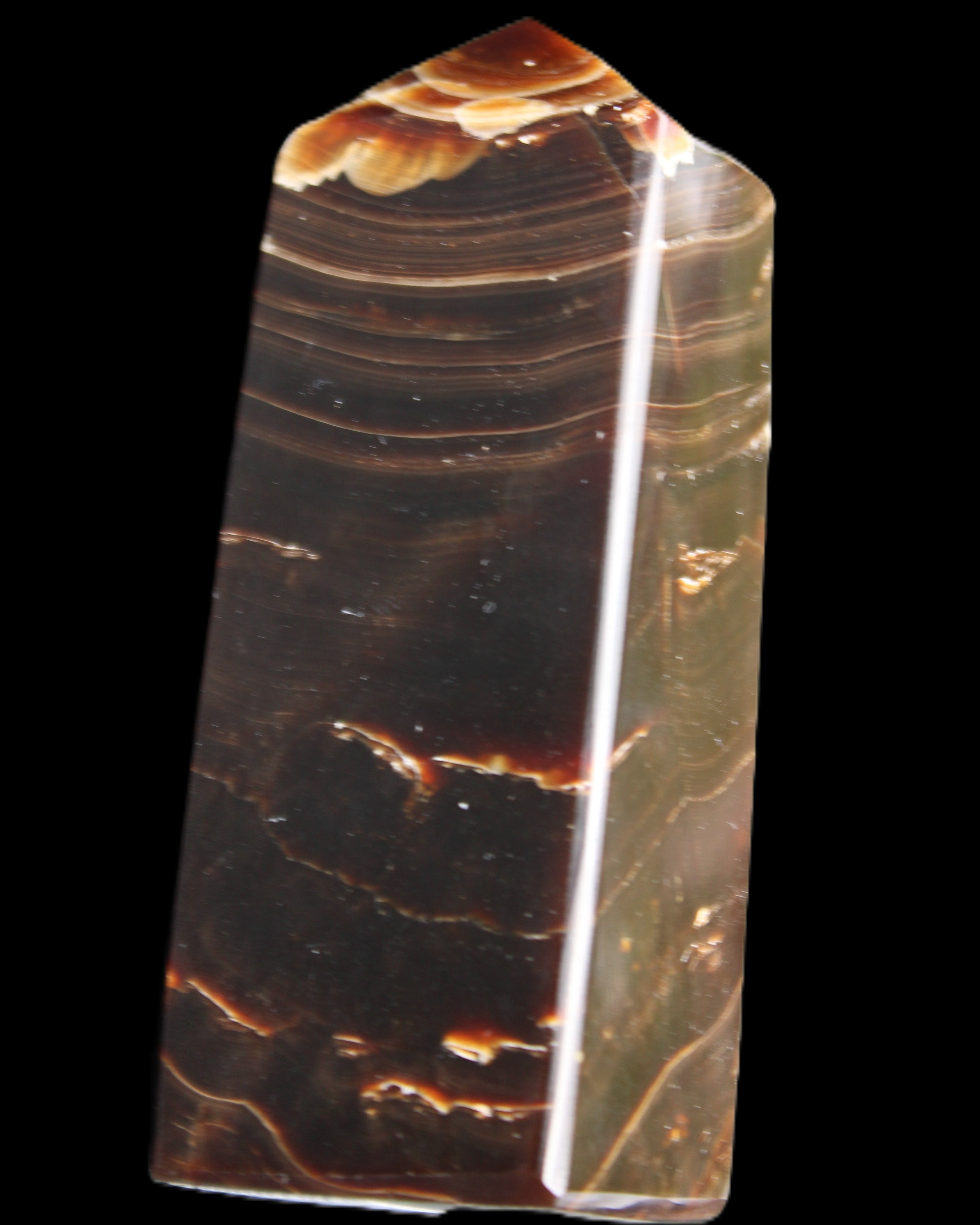 Chocolate Calcite obelisk 92*33*28mm 196g in sunlight - Rocks and Things Store
