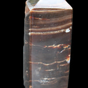 Chocolate Calcite obelisk 92*33*28mm 196g in sunlight - Rocks and Things Store