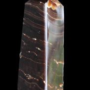 Chocolate Calcite obelisk 92*33*28mm 196g in sunlight - Rocks and Things Store