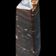 Chocolate Calcite obelisk 92*33*28mm 196g in sunlight - Rocks and Things Store