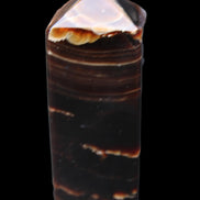 Chocolate Calcite obelisk 92*33*28mm 196g in sunlight - Rocks and Things Store