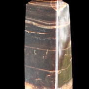 Chocolate Calcite obelisk 94*32*31mm 218g in sunlight - Rocks and Things Store