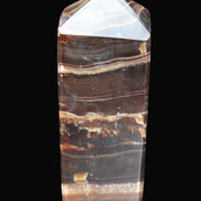 Chocolate Calcite obelisk 94*32*31mm 218g in sunlight - Rocks and Things Store