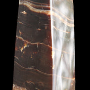 Chocolate Calcite obelisk 94*32*31mm 218g in sunlight - Rocks and Things Store