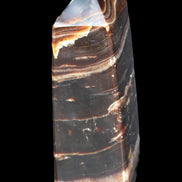 Chocolate Calcite obelisk 94*32*31mm 218g in sunlight - Rocks and Things Store