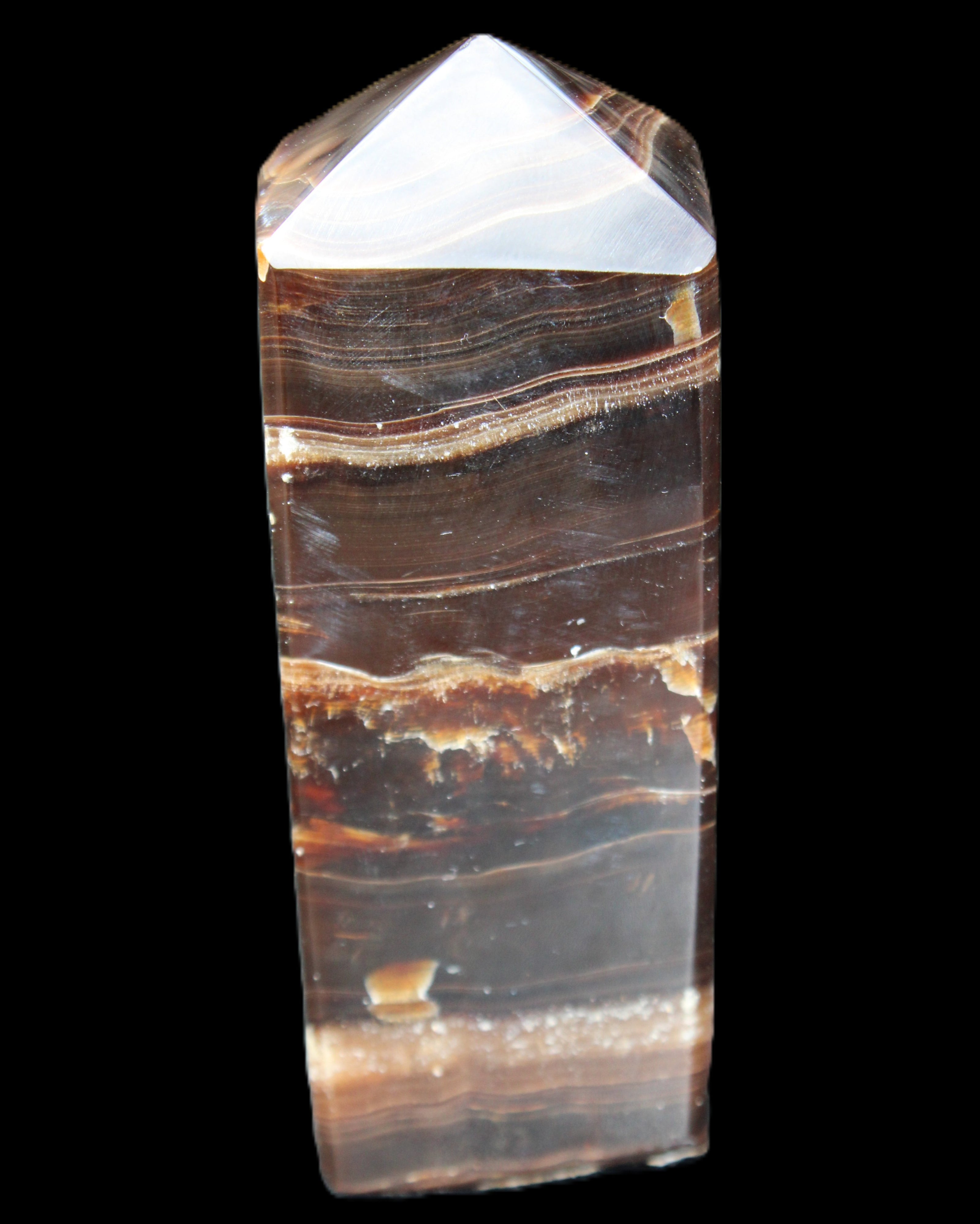 Chocolate Calcite obelisk 94*32*31mm 218g in sunlight - Rocks and Things Store