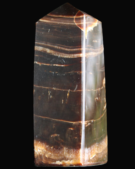 Chocolate Calcite obelisk 94*32*31mm 218g in sunlight - Rocks and Things Store