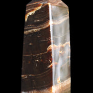Chocolate Calcite obelisk 94*32*31mm 218g in sunlight - Rocks and Things Store